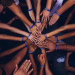 Hands joined in circle of support
