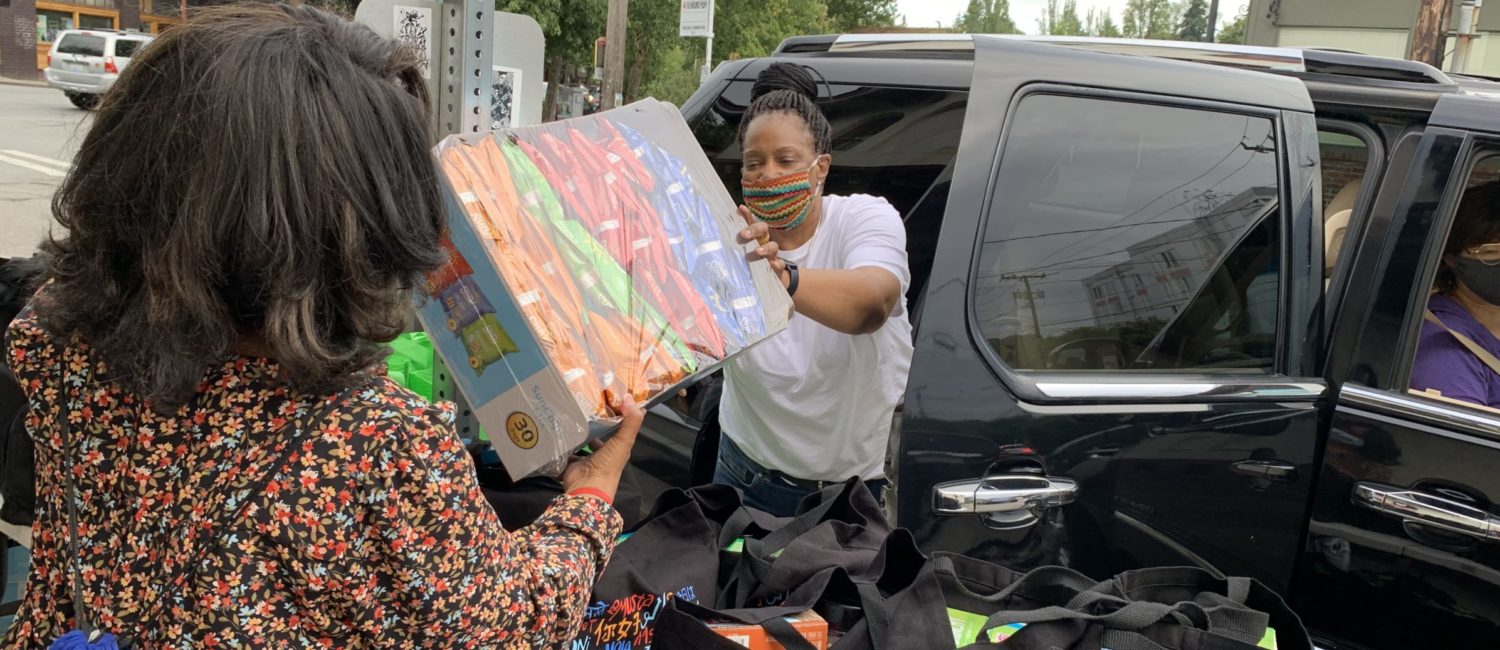 FAST volunteers load car with family care package