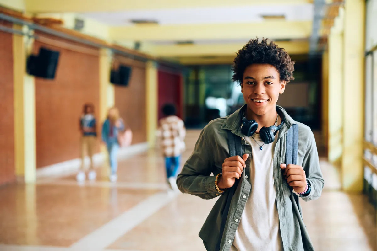 smiling youth in school hallway